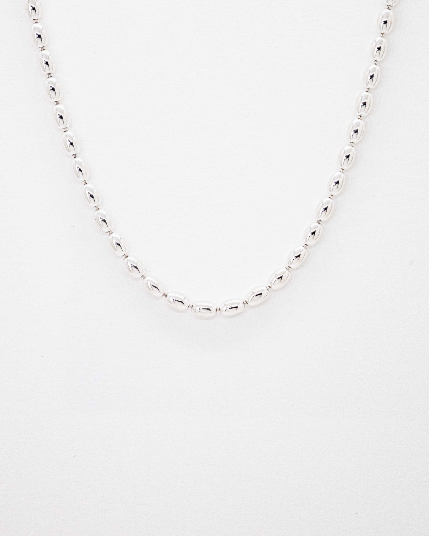 Oval ball silver Necklace with gold beans