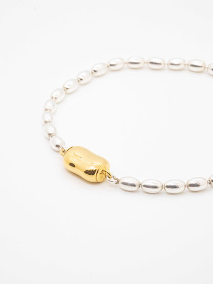 Oval ball silver Bracelet with gold beans